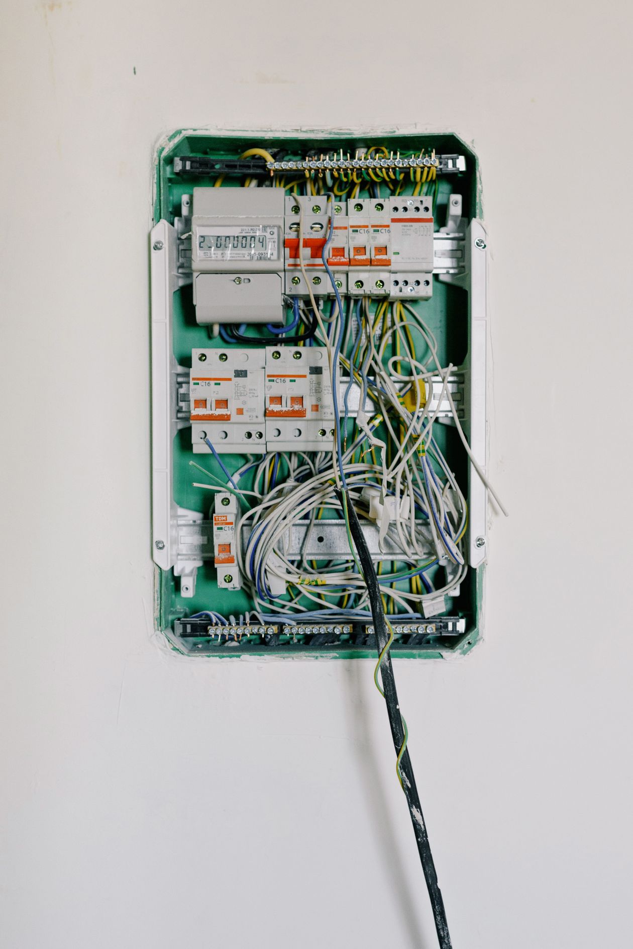 Electrician working on a circuit breaker panel