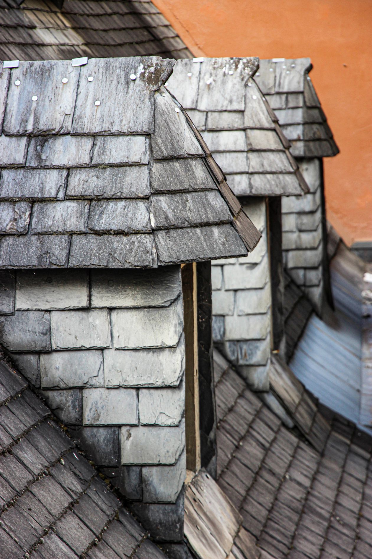 Slate shingle roof on a pitched building